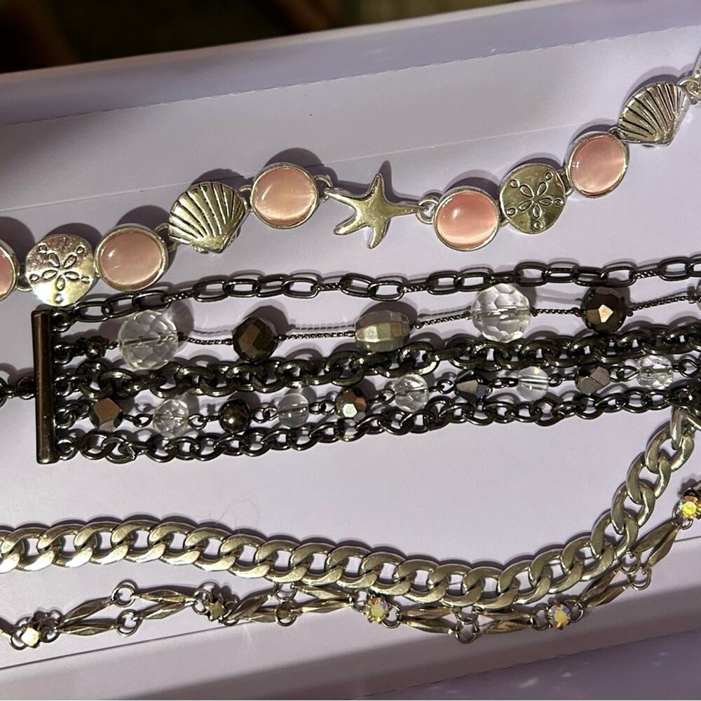 Lot of 4 bracelets, all wearable and in great condition.